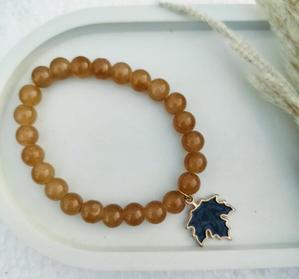 Glass bead bracelet with charm